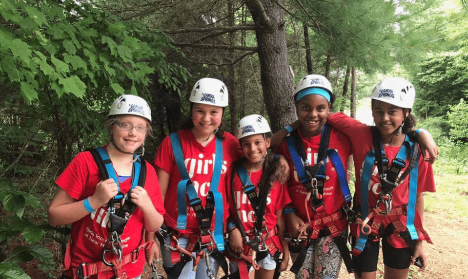 group of girls wearing rock climbing gear